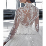 High end Shiny Arab Lace Applique Wedding Dress Back Button Design Transparent Tulle Long Sleeve High Neck Dubai Robe De